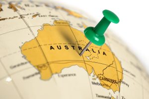 Globe with a green pin marking Australia