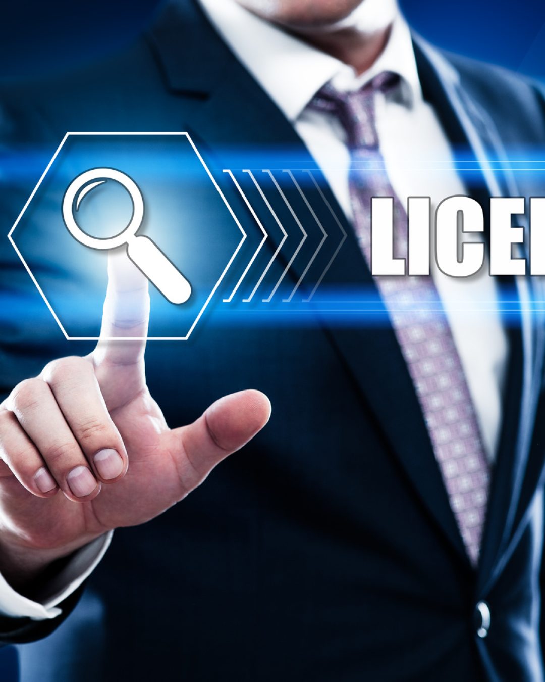 Business, technology, internet concept on hexagons and transparent honeycomb background. Businessman pressing button on touch screen interface and select licensing